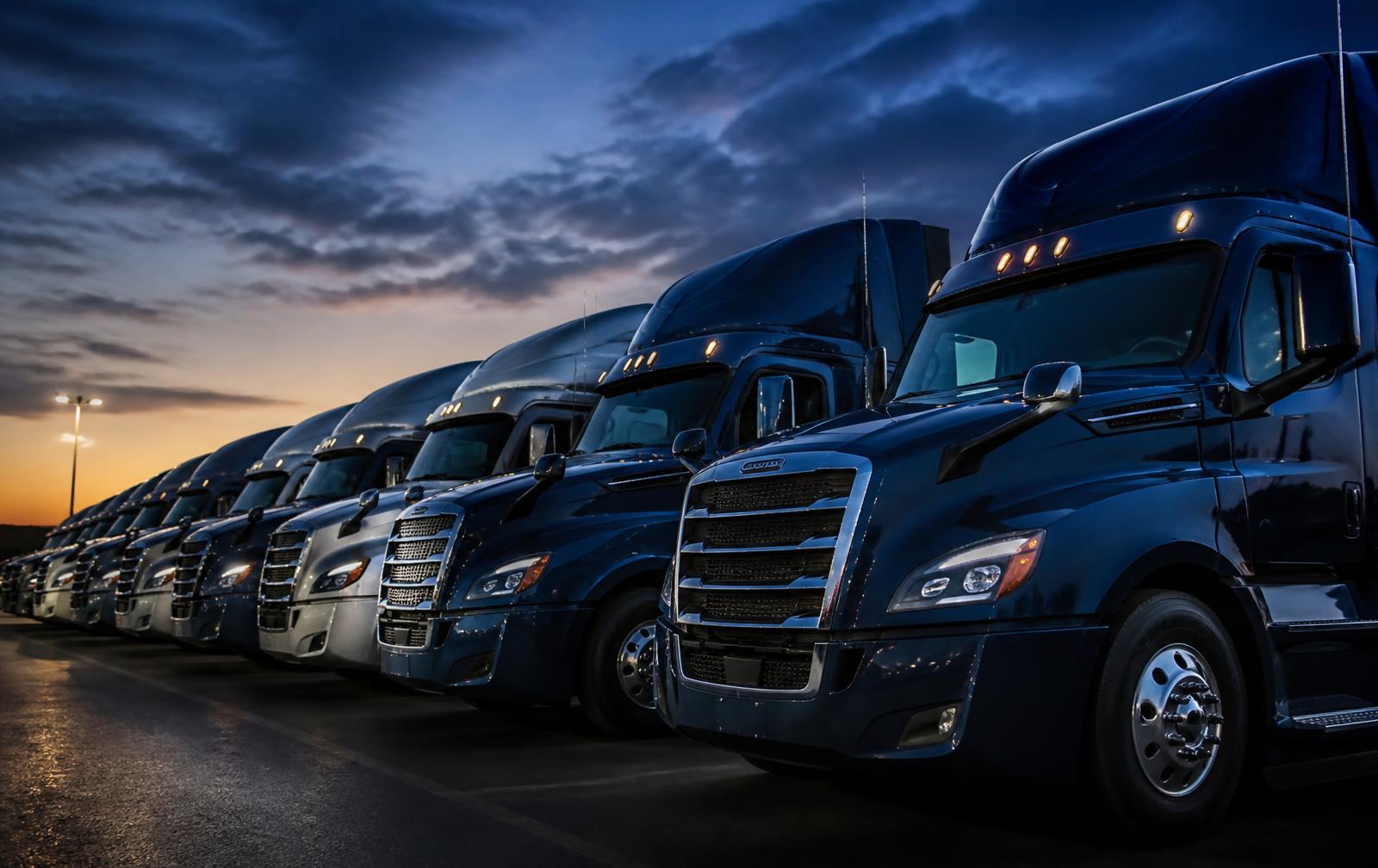 Heavy-duty trucks at a commercial dealership used for finance and insurance transactions